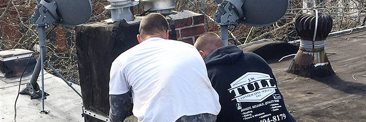 J.W. Tull team members engaging in Roof Repair